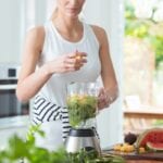 10 weight-loss tips for the New Year.Lady preparing a smoothie