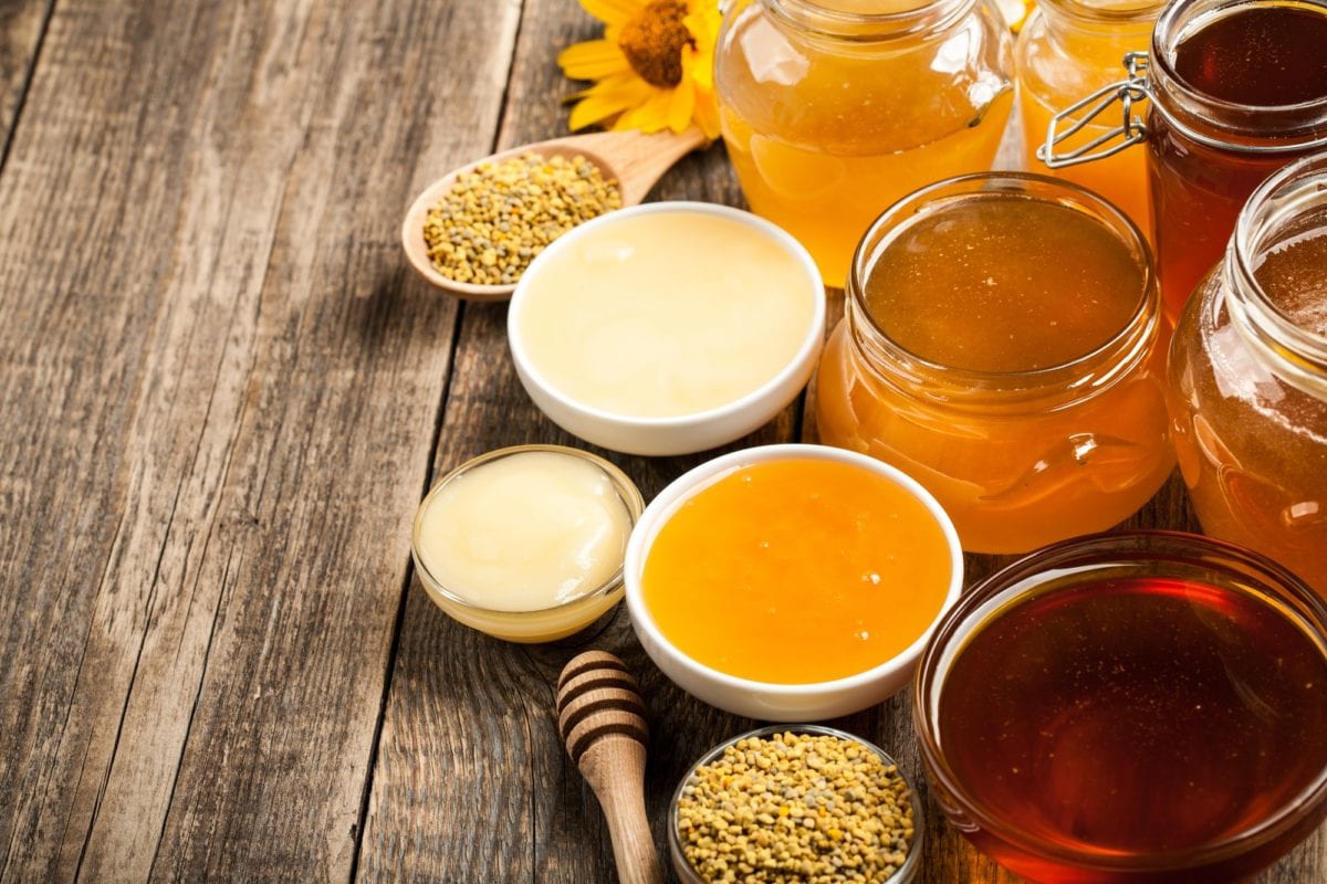 6 healthy grocery splurges worth the cost. Various honey on wooden table